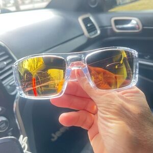 Gold and NEW Clear Frame Oakley Sunglasses with Yellow Lenses.